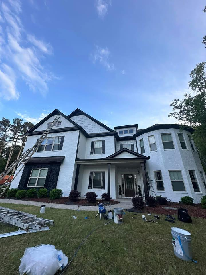 Freshly painted two-story white brick home exterior